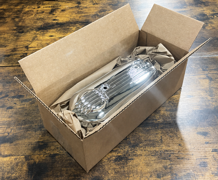 A box with a Gold Wing part in it getting packed up for shipping