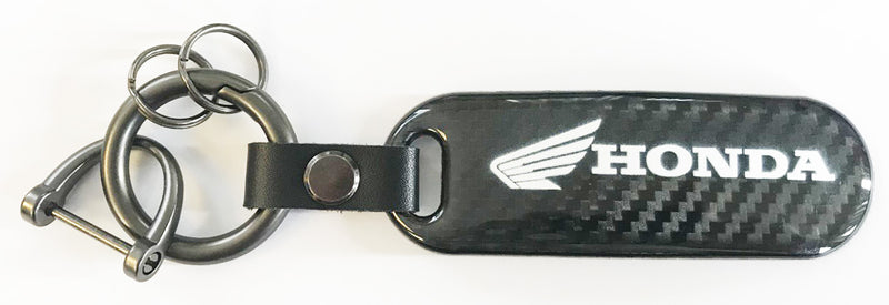 Porte-clés logo Honda avec fond carbone